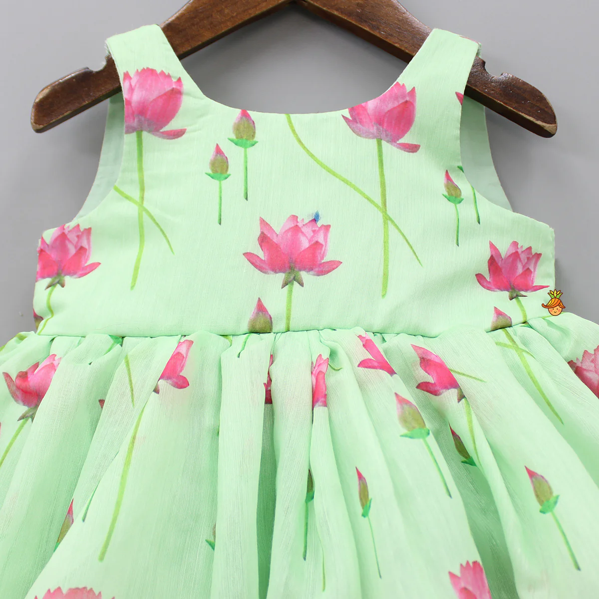 Floral Printed Green Dress With Contrasting Back Bow - Image 3