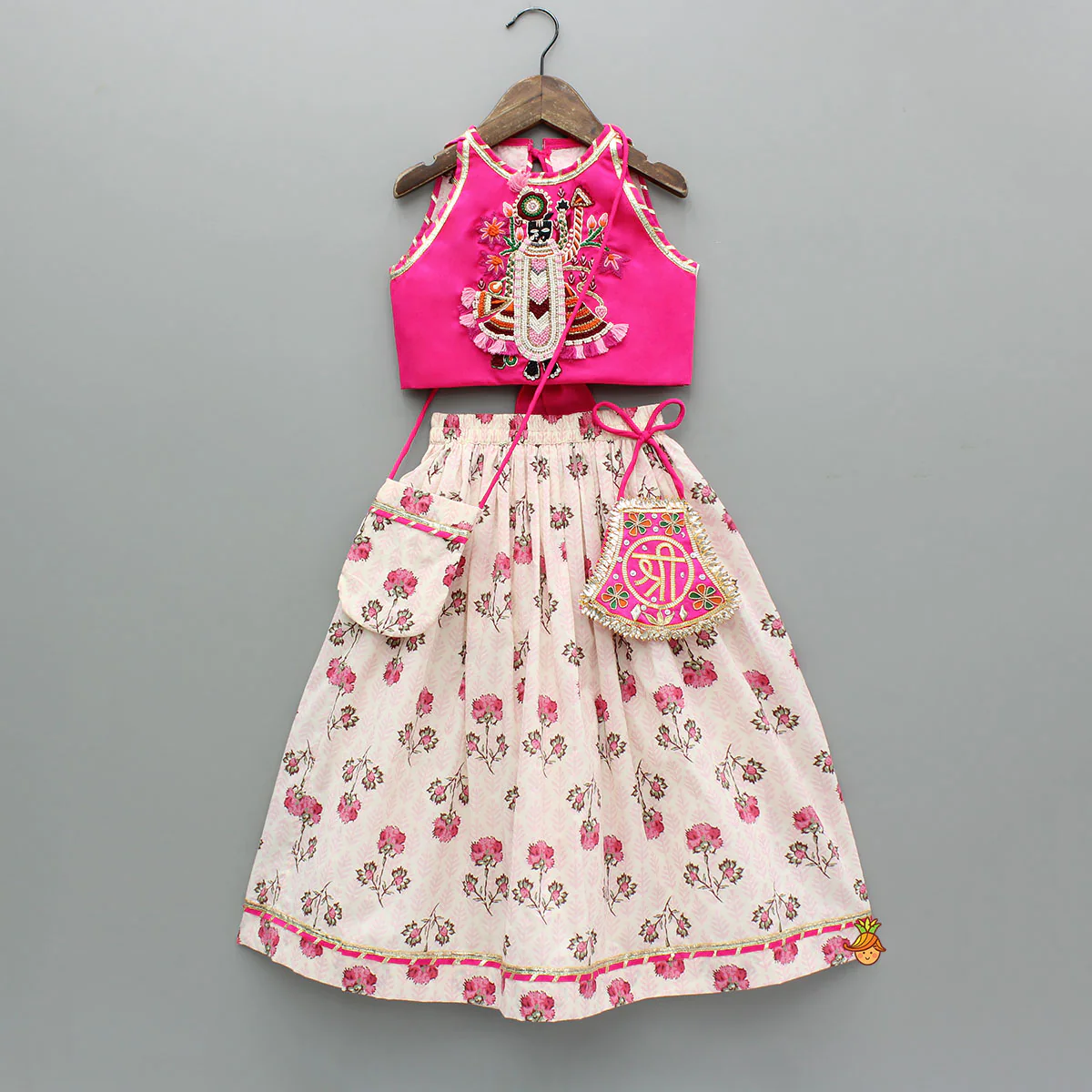 Goddess Embroidered Pink Top And Beautiful Tassels Embellished Lehenga With Matching Sling Bag