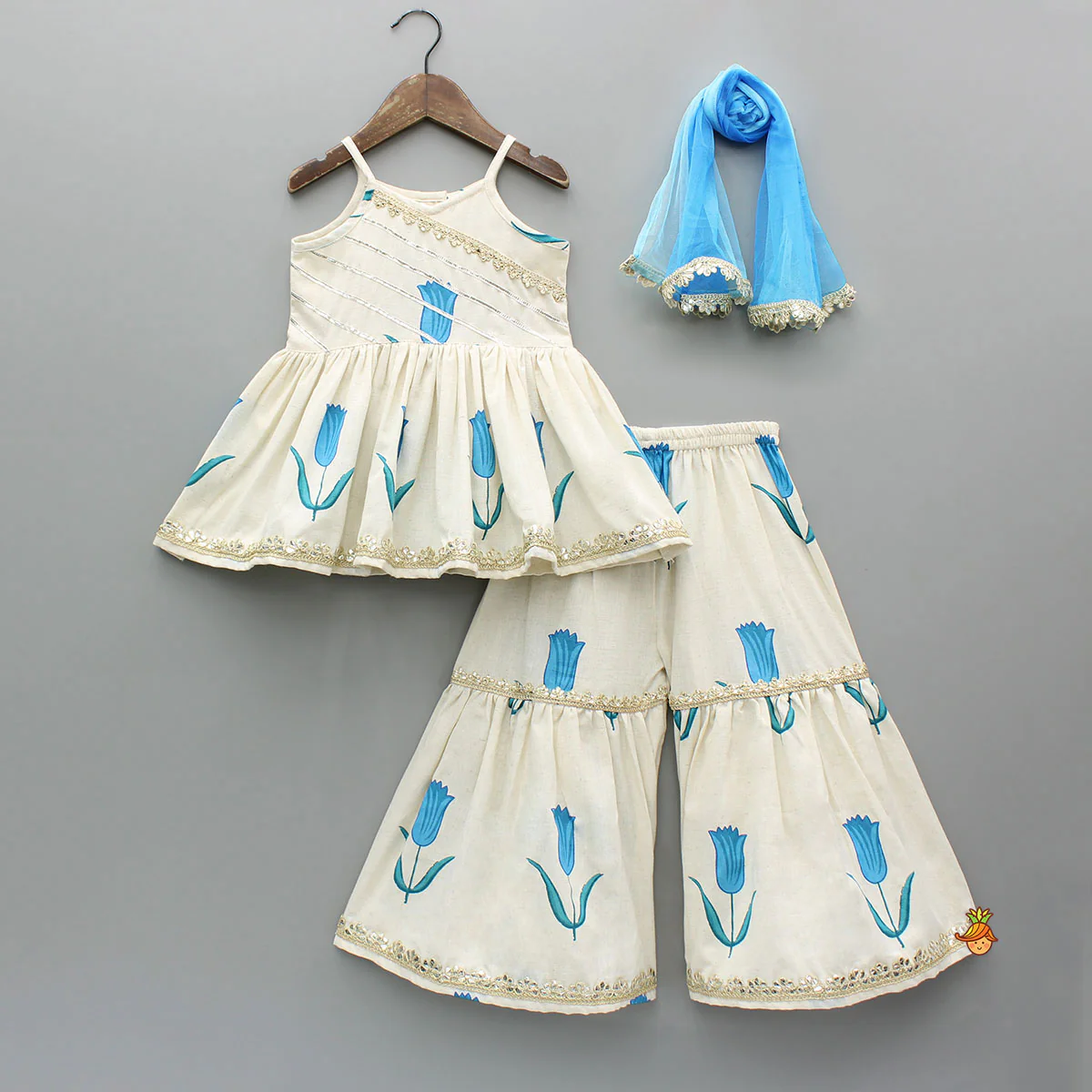 Tulip Printed Strappy Off White Kurti With Printed Sharara And Blue Dupatta